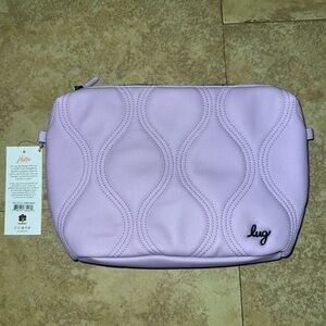 NWT lug Volley Matte Luxe vegan leather pouch in sugar plumb. Dust bag included